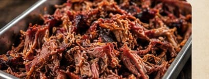 A tray of freshly pulled smoked pork